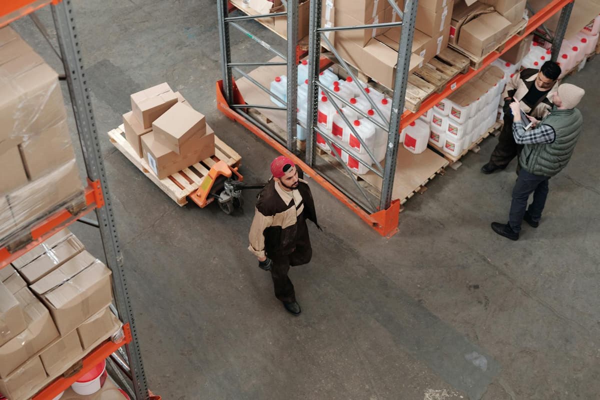Modern warehouse with organised shelving and inventory boxes — wholesale and retail operations